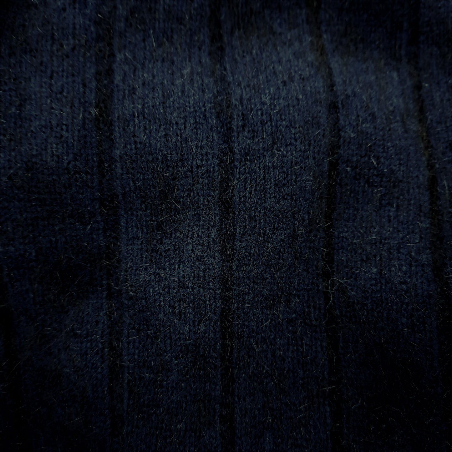 A men's possum merino ribbed full zip jacket with collar. It can be worn open or zipped up for extra warmth. Great with jeans or dress pants. Made in NZ by Lothlorian for their Zinity Collection. Available in sizes S, M, L, XL, XXL. Midnight.