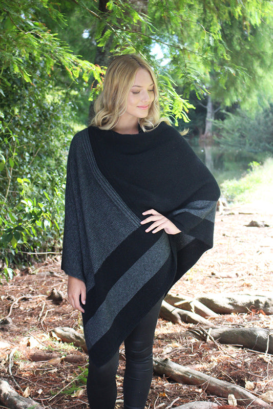 A beautiful symmetrical poncho with geometric pattern in a contrast colour. Textured knit structure feature in contrast panel. This is a generous size poncho in one size only. There are 5 stunning colourways to choose from.