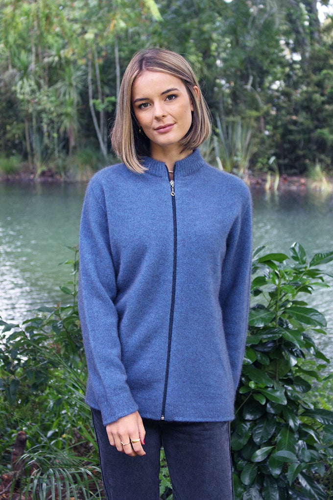 A zip through cardigan in a possum merino blend available in sizes XS-XXL. Made in NZ by Lothlorian. NOTE: * after colour denotes a custom colour to our store, not always readily available. Light Blue.