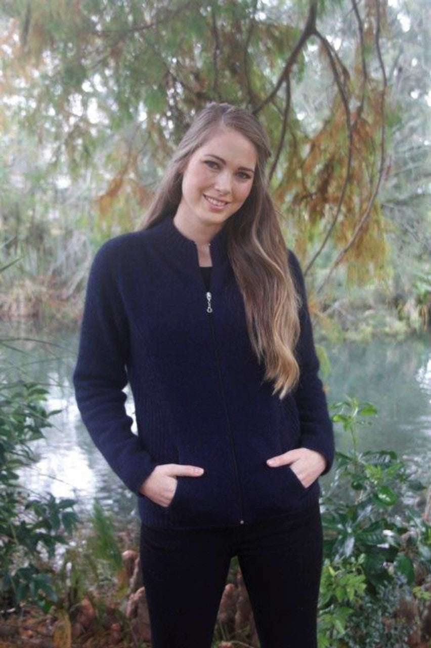 A flattering but practical style jacket. Rib details on the side panels add a little shape, has a full zip and seamless pockets. Available in sizes XS, S, M, L, XL, XXL. Made in NZ from a possum merino blend by Lothlorian. Midnight.