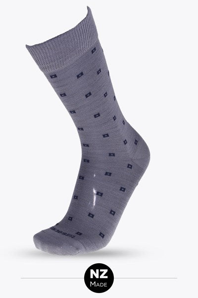 PRODUCT DESCRIPTION
Step into everyday comfort with the Fair and Square Merino Crew Sock. Mid grey with navy squares these sock are made from ultra-soft Merino wool. Merino is naturally breathable, moisture-wicking, and warm, perfect for year-round wear. Featuring a gentle comfort top that stays up without squeezing, it’s the ideal blend of style, support, and all-day ease. Simple, square, and seriously comfortable. Made in NZ by NZ Sock Co.