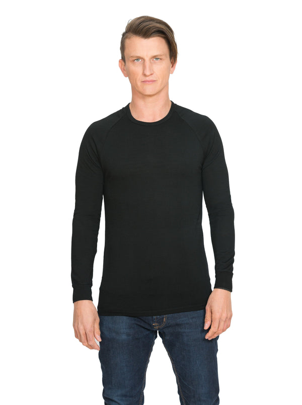 Designed with a crew neck this merino long sleeve tee can be worn on it's own or as a base or mid layer. Has a shaped tail at the back to tuck in. Perfect all year round!! This is a slim fit top so size up if you prefer a little wiggle room. Available in black only. Sizes S - 3XL. Proudly made in NZ.