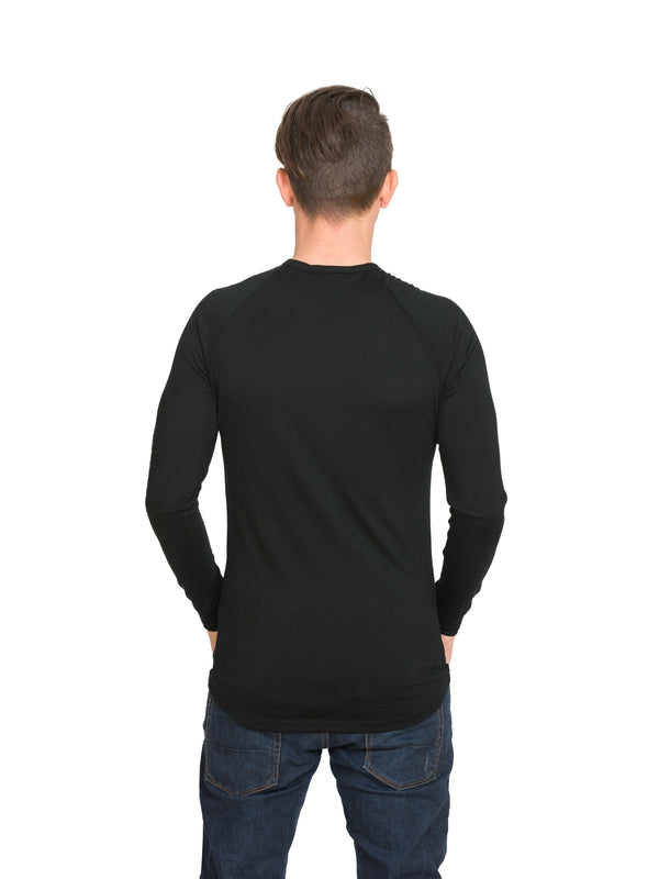 Designed with a crew neck this merino long sleeve tee can be worn on it's own or as a base or mid layer. Has a shaped tail at the back to tuck in. Perfect all year round!! This is a slim fit top so size up if you prefer a little wiggle room. Available in black only. Sizes S - 3XL. Proudly made in NZ.