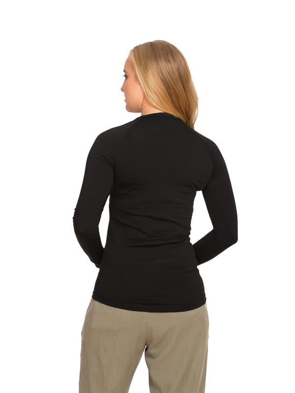 Designed with a crew neck this merino long sleeve tee can be worn on it's own or as a base or mid layer. Has a shaped tail at the back to tuck in. Perfect all year round!! This is a slim fit top so size up if you prefer a little wiggle room. Available in black only. Sizes S - 3XL. Proudly made in NZ.
