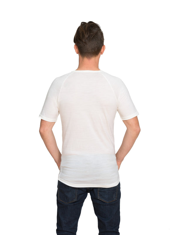 Designed with a vee neck this merino short sleeve tee can be worn on its own or as a base or mid layer. Perfect all year round!! This is a slim fit tee so size up if you prefer a little wiggle room. Available in ivory white only. Sizes S - 3XL. Proudly made in NZ.