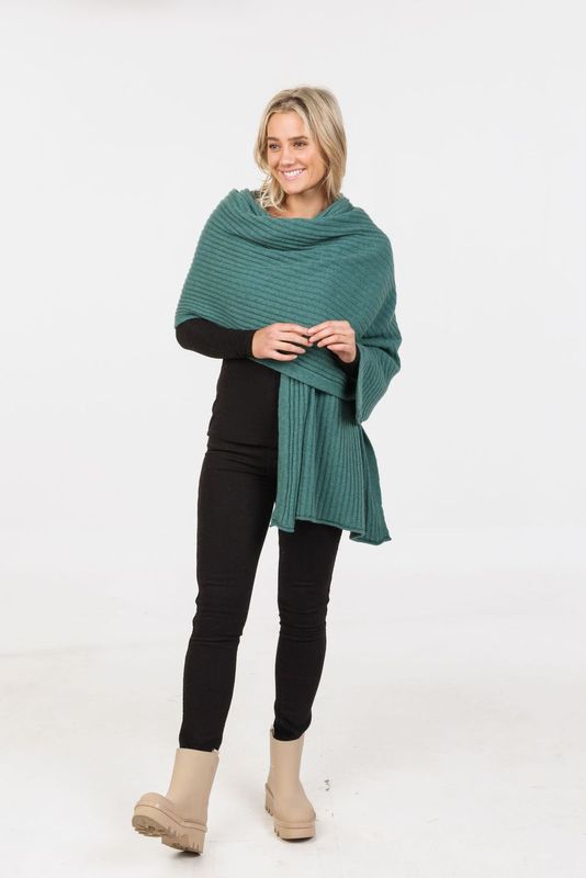 This gorgeous versatile ribbed wrap is soft, warm, light and the perfect shape to throw on for any occasion. It can be worn several ways and is an ideal travel piece.