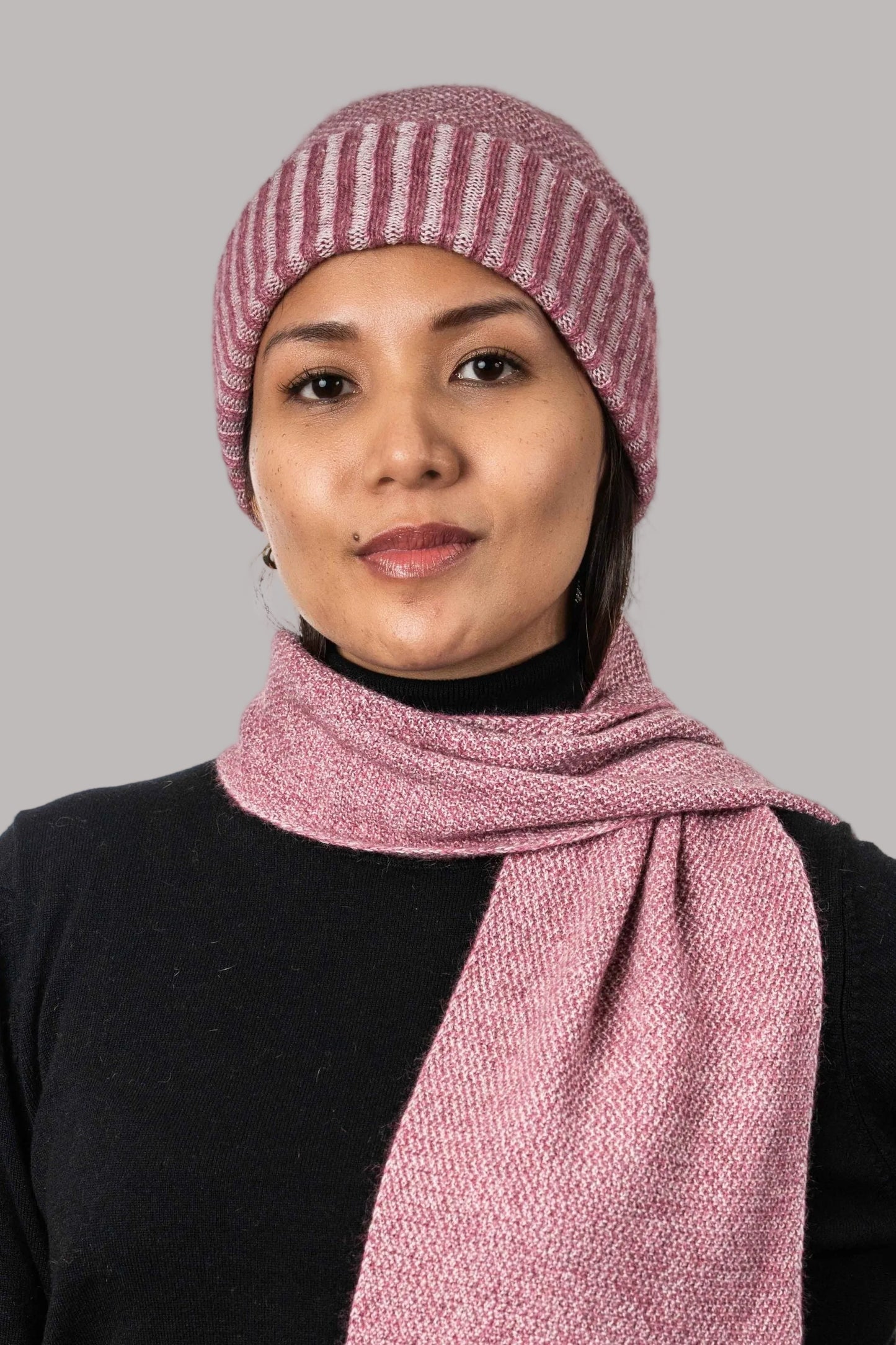 Generous in width and length, this cosy scarf features a two tone textured moss stitch pattern. Made from a blend of possum, merino and silk it is a perfect winter staple. Made by Koru of NZ.