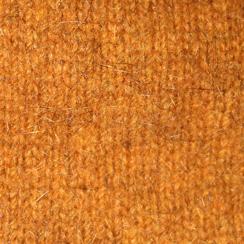 A beautiful textured wrap that can be worn several ways - as a poncho with the zip over the shoulder, zip to the front like a cape, as a wrap or scarf and if you feel a bit daring, a skirt! Available in 12 colourways. Made in NZ by Lothlorian. Gold.