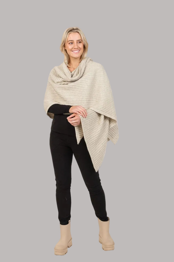 This gorgeous versatile ribbed wrap is soft, warm, light and the perfect shape to throw on for any occasion. It can be worn several ways and is an ideal travel piece.