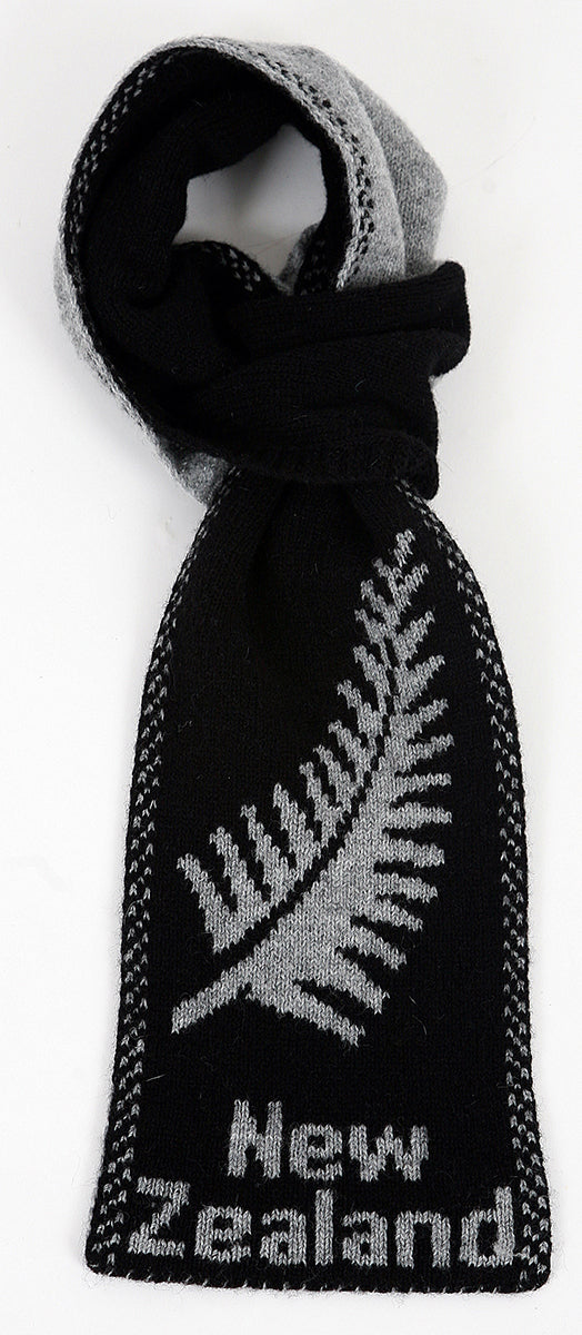 A double thickness reversible loop scarf with border decoration and the silver fern and New Zealand knitted in. Comes in one size only. Made in NZ by Lothlorian. Black.