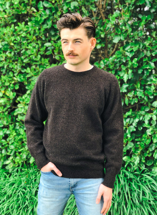 A classic crew neck style made from possum merino, with rib finish on neck, cuff and band. A wardrobe staple for year-round wear. Dress up or down. Available in sizes S, M, L, XL, XXL. Made in NZ by Lothlorian. Brown Marl.