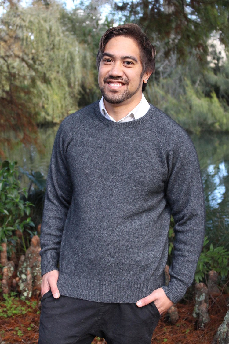 A classic crew neck style made from possum merino, with rib finish on neck, cuff and band. A wardrobe staple for year-round wear. Dress up or down. Available in sizes S, M, L, XL, XXL. Made in NZ by Lothlorian. Charcoal.