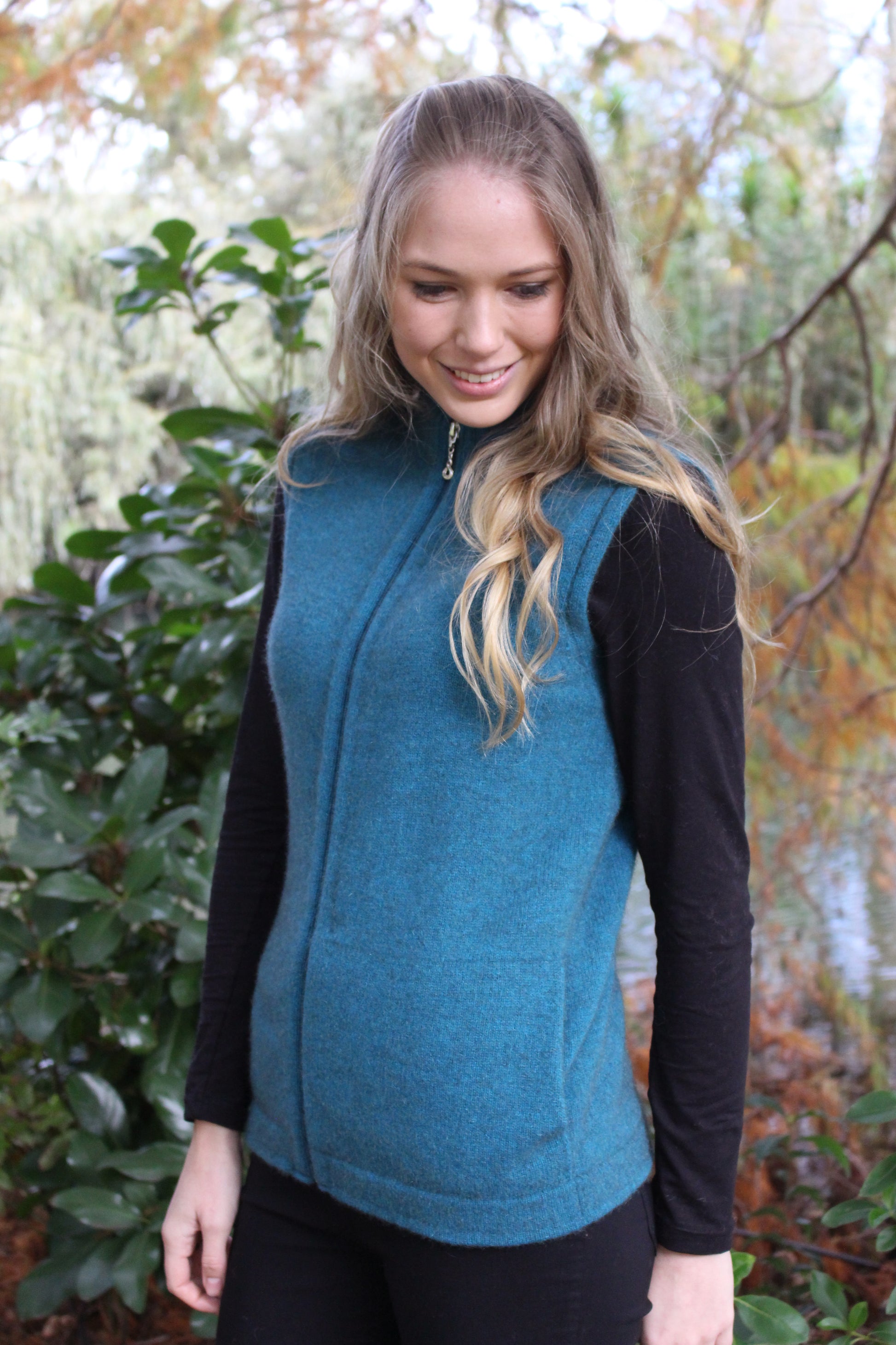 A full zip vest with generous pockets and a longer length. A possum merino blend available in sizes XS - XXL. Made in NZ by Lothlorian. NOTE: * after colour denotes a custom colour to our store, not always readily available. Teal.