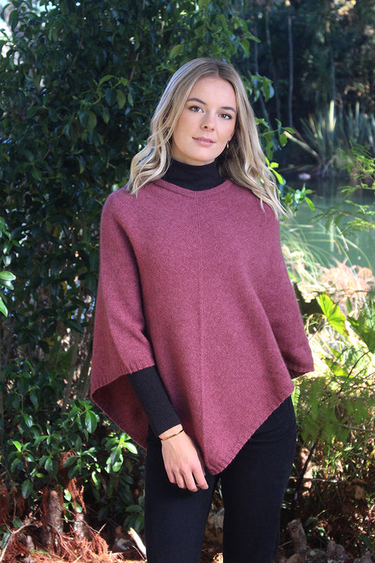 A simple plain poncho with rib neck band and hem.