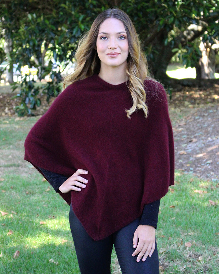 A simple plain poncho with rib neck band and hem.