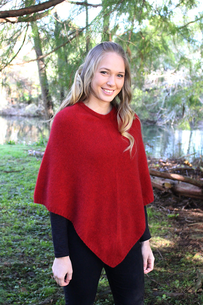 A simple plain poncho with rib neck band and hem.