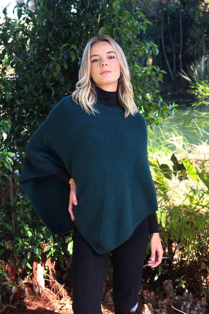 A simple plain poncho with rib neck band and hem.