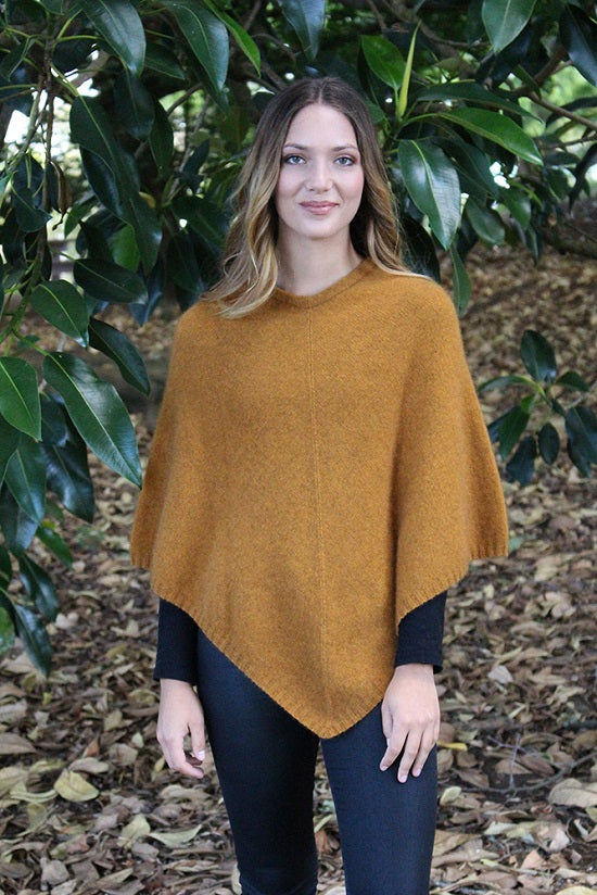 A simple plain poncho with rib neck band and hem.