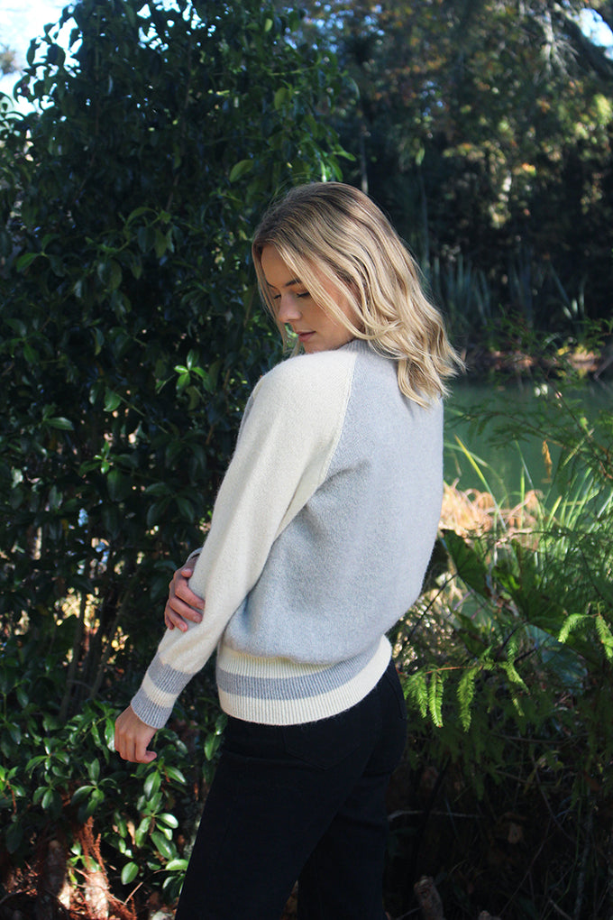 Adding a fresh & stylish look to the classic crew with contrasting sleeves and stripe detail on the bands. Made with the finest Alpaca fleece for a comfortable, soft, warm and any occasion jumper. Made in NZ by Lothlorian. Dove/Natural only.