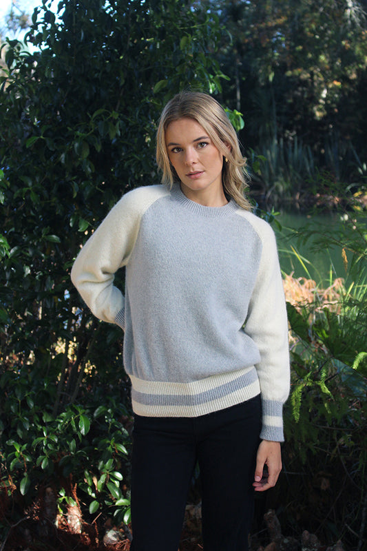 Adding a fresh & stylish look to the classic crew with contrasting sleeves and stripe detail on the bands. Made with the finest Alpaca fleece for a comfortable, soft, warm and any occasion jumper. Made in NZ by Lothlorian. Dove/Natural Only