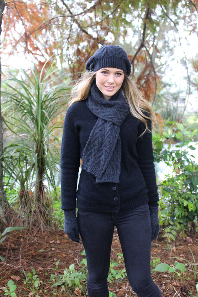 With a generous sized crown this chunky cabled beanie can be worn in a slouch style or move the slouch to the side like a beret! Made in NZ by Lothlorian. Slate.