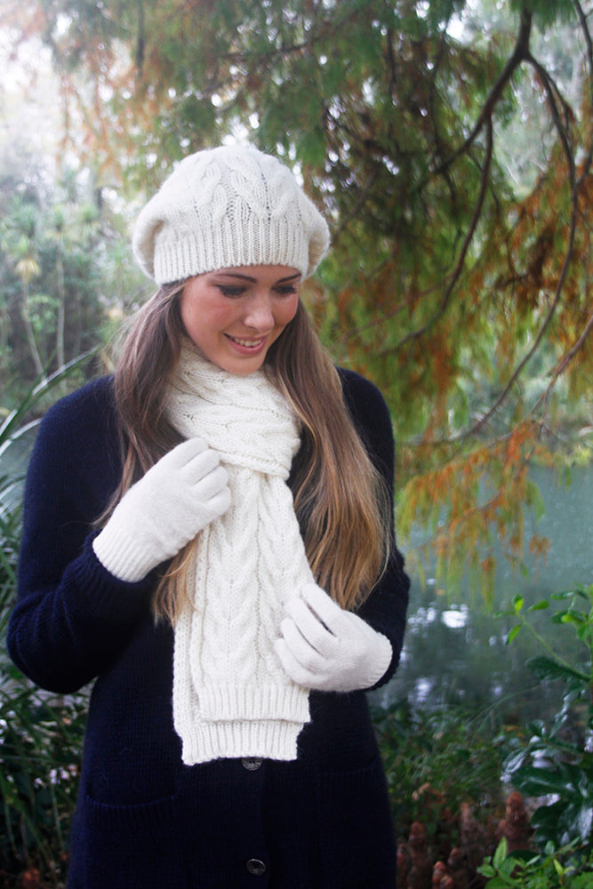 With a generous sized crown this chunky cabled beanie can be worn in a slouch style or move the slouch to the side like a beret! Made in NZ by Lothlorian. Natural.