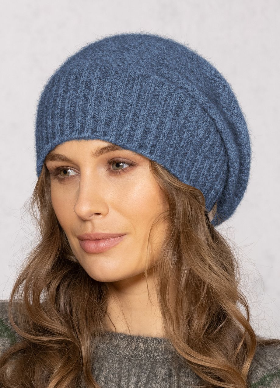 This fashion baggie beanie is knitted in a moss stitch with a rib band that can be worn as is or folded back. Made from a blend of possum merino and available in one size only. Made in Christchurch, NZ by Noble Wilde. 