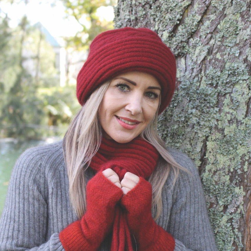 A luxurious double thickness hat with cable detail. A blend of possum merino in one size only. Made in NZ by Lothlorian for their Zinity Collection. Red.