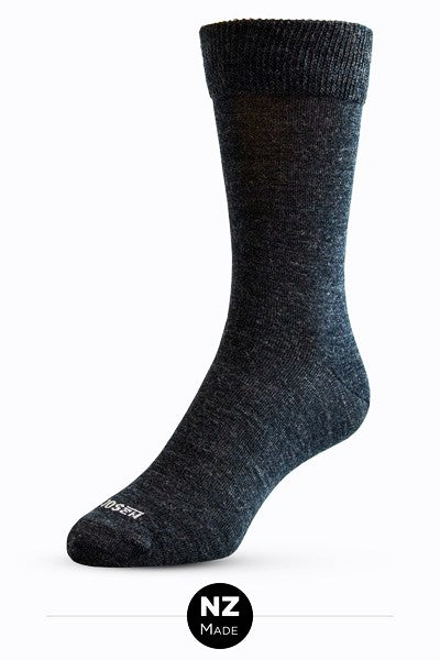 A fine knit Merino Wool dress sock with a new improved cuff for comfortable wear. NZ Sock Co have swapped out the traditional 1 x1 elasticated rib cuff and replaced it with a high stretch, double layer cuff for soft, non-restrictive comfort. Comes in a 2 pair pack. Made in Ashburton, NZ. Charcoal.