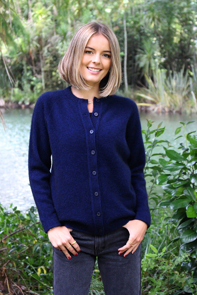 A timeless crew neck, button through cardigan. Great for layering up. Wear open or buttoned up as a top layer. A possum merino blend available in sizes XS - XXL. Made in NZ by Lothlorian. NOTE: * after colour denotes a custom colour to our store, not always readily available. Midnight.