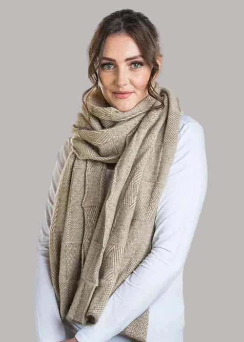 How beautiful is the Jacquard Wrap? A multi-textured design, knitted in two-tone colours with a scallop edge finish. This is the perfect accessory for daytime, a night out or a trip away. Wear it your way to suit your occasion. Luxury at its finest! Approx. 56cm wide x 200cm long. Made by Koru of NZ.