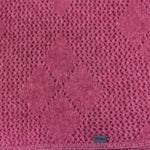 This diamond patterned throw is ideal for home for those cooler nights as a knee rug or a shawl. Cosy, light & warm it is also ideal for travelling with. Approx. 120cm x 130cm made from possum merino by Koru in Warkworth, NZ. Rose.