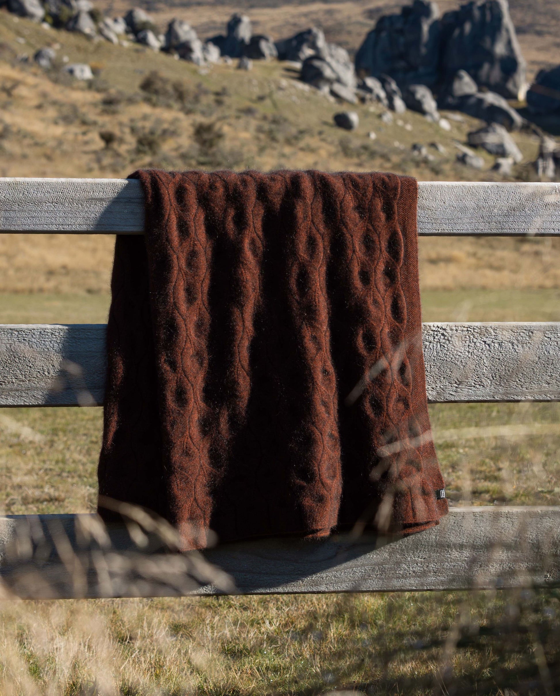 The Liz Leaf Design Blanket features a beautifully textured, cable-knit pattern, irresistibly warm, perfect for cozying up during cooler months or drape over a bed, chair or couch to add a touch of luxury. Made in NZ by Noble Wilde.