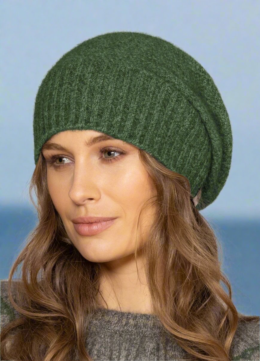 This fashion baggie beanie is knitted in a moss stitch with a rib band that can be worn as is or folded back. Made from a blend of possum merino and available in one size only. Made in Christchurch, NZ by Noble Wilde. 