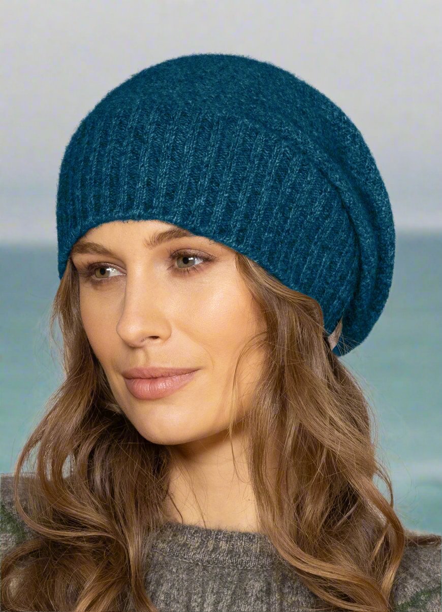 This fashion baggie beanie is knitted in a moss stitch with a rib band that can be worn as is or folded back. Made from a blend of possum merino and available in one size only. Made in Christchurch, NZ by Noble Wilde. 