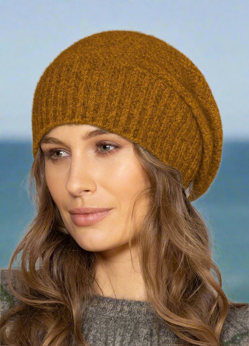 This very cool baggie beanie is knitted in a moss stitch with a rib band that can be worn as is or folded back. Made from a blend of possum merino it will keep you warm as well as looking stylish! Available in one size only. Made in Christchurch, NZ by Noble Wilde.