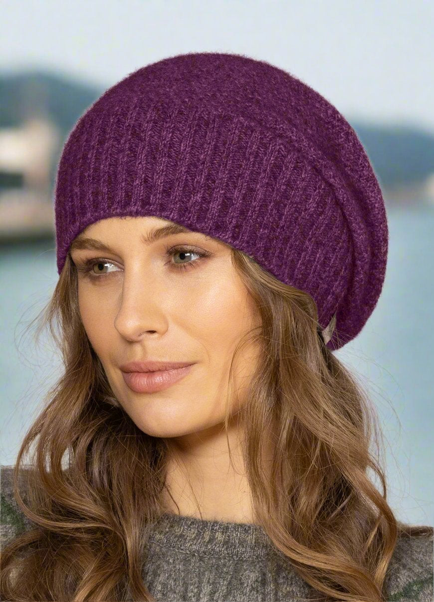 This very cool baggie beanie is knitted in a moss stitch with a rib band that can be worn as is or folded back. Made from a blend of possum merino it will keep you warm as well as looking stylish! Available in one size only. Made in Christchurch, NZ by Noble Wilde.