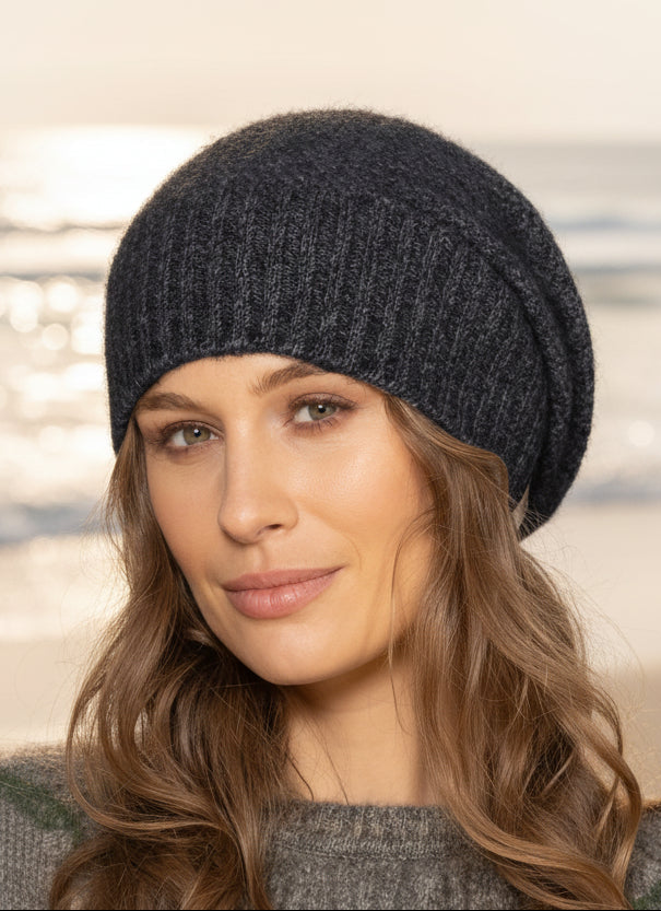 This very cool baggie beanie is knitted in a moss stitch with a rib band that can be worn as is or folded back. Made from a blend of possum merino it will keep you warm as well as looking stylish! Available in one size only. Made in Christchurch, NZ by Noble Wilde.