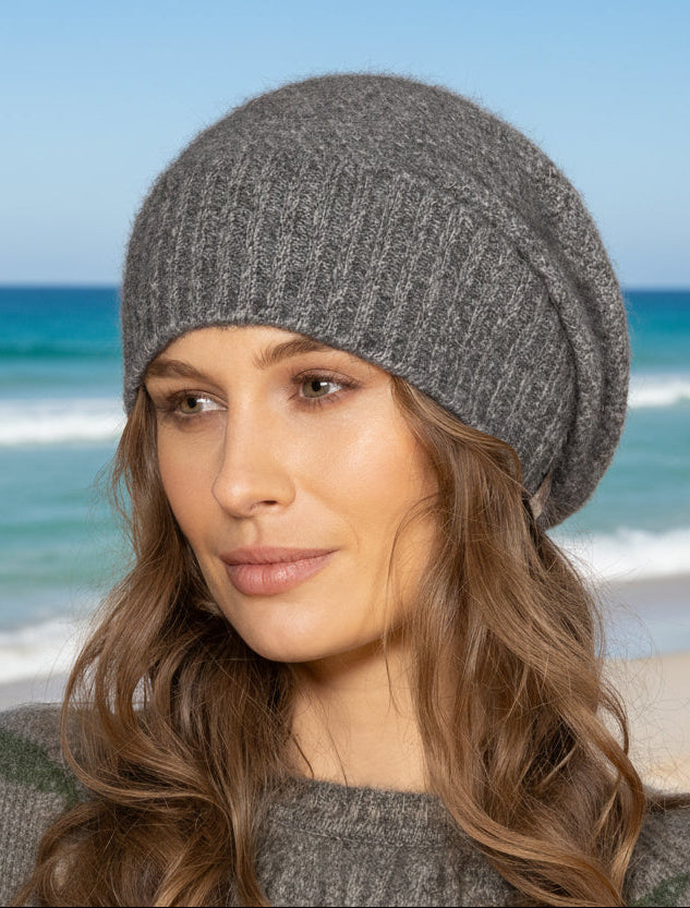 This very cool baggie beanie is knitted in a moss stitch with a rib band that can be worn as is or folded back. Made from a blend of possum merino it will keep you warm as well as looking stylish! Available in one size only. Made in Christchurch, NZ by Noble Wilde.