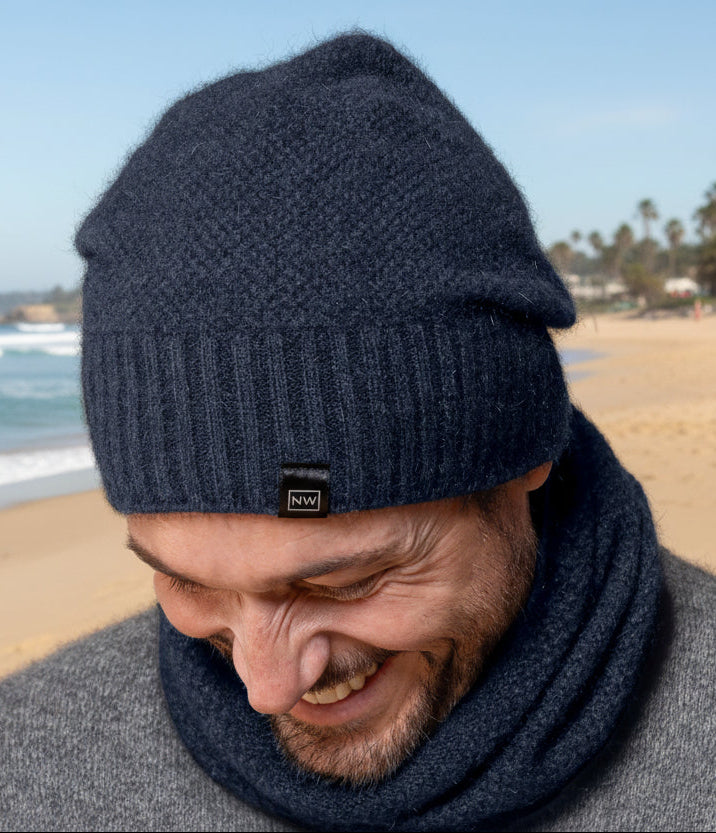 This very cool baggie beanie is knitted in a moss stitch with a rib band that can be worn as is or folded back. Made from a blend of possum merino it will keep you warm as well as looking stylish! Available in one size only. Made in Christchurch, NZ by Noble Wilde.