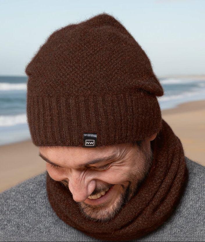 This very cool baggie beanie is knitted in a moss stitch with a rib band that can be worn as is or folded back. Made from a blend of possum merino it will keep you warm as well as looking stylish! Available in one size only. Made in Christchurch, NZ by Noble Wilde.