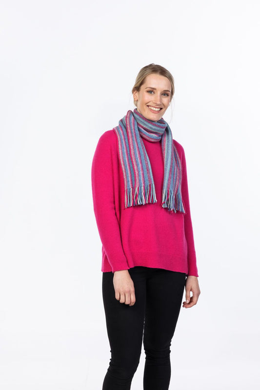 The multi striped scarf displays an array of colours making it a very versatile style for anyone's wardrobe. It can be worn on its own or easily paired with a Native World garment or other accessory! Made with a blend of possum fibre, merino wool and a touch of nylon for strength. It is warm, soft & light and available in one size only. Made by Native World, Palmerston North, NZ. Peony Stripe.