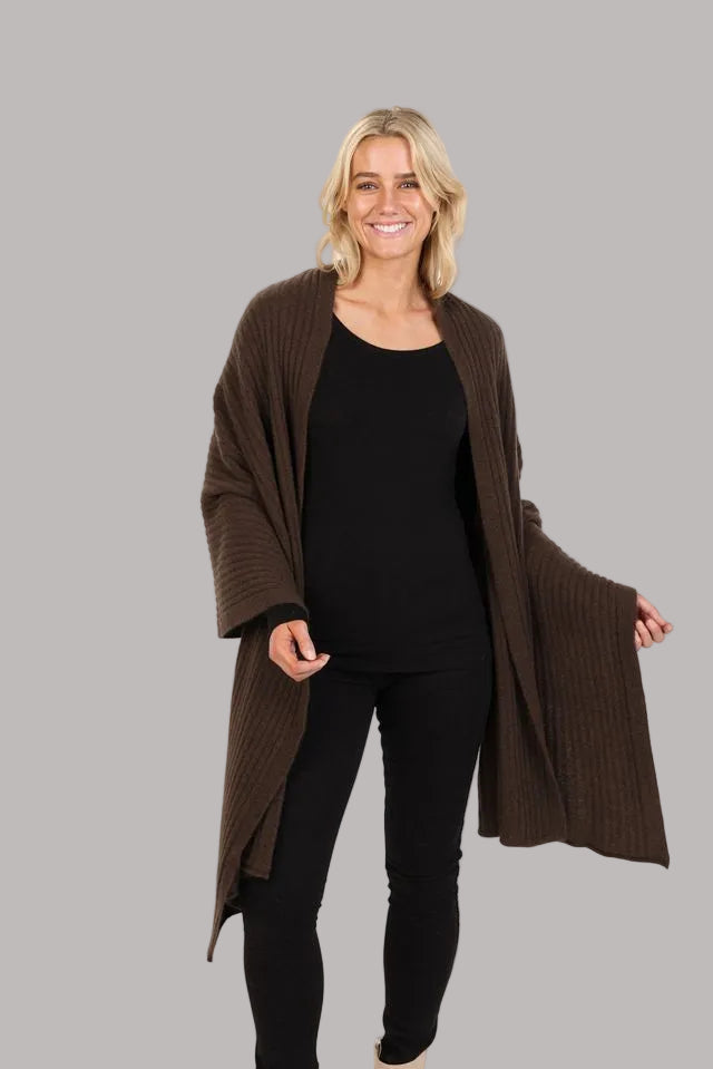 This gorgeous versatile ribbed wrap is soft, warm, light and the perfect shape to throw on for any occasion. It can be worn several ways and is an ideal travel piece.