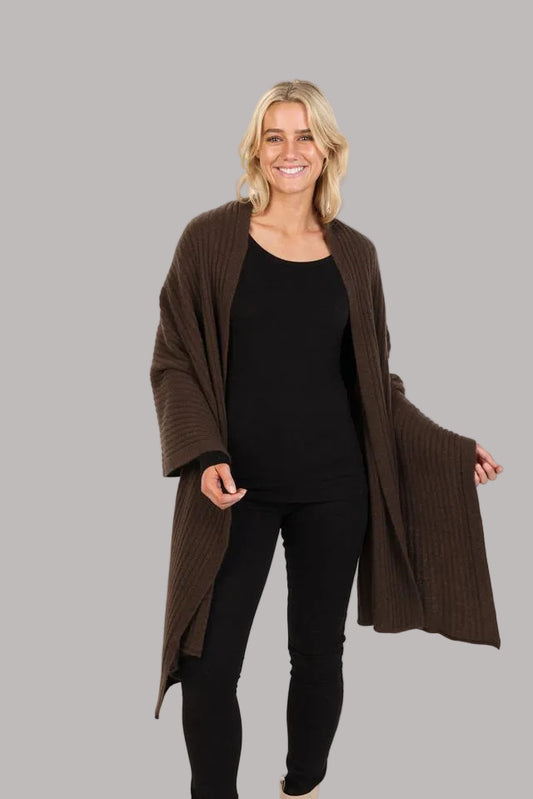 This gorgeous versatile ribbed wrap is soft, warm, light and the perfect shape to throw on for any occasion. It can be worn several ways and is an ideal travel piece.