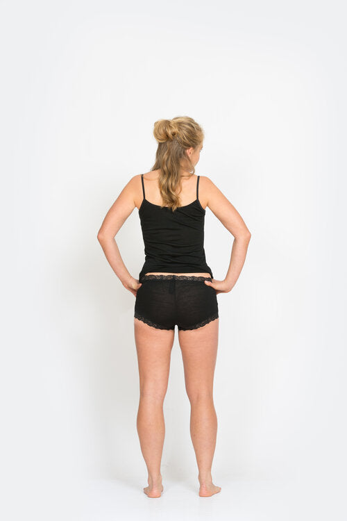 The reversible merino short cami can be worn as a V neck or scoop neck. Made from Super Fine New Zealand Merino in a single jersey knit fabric it is light, soft and so warm. Can be worn year-round. Available in Black or Pearl sizes S - 2XL. Black. NS350