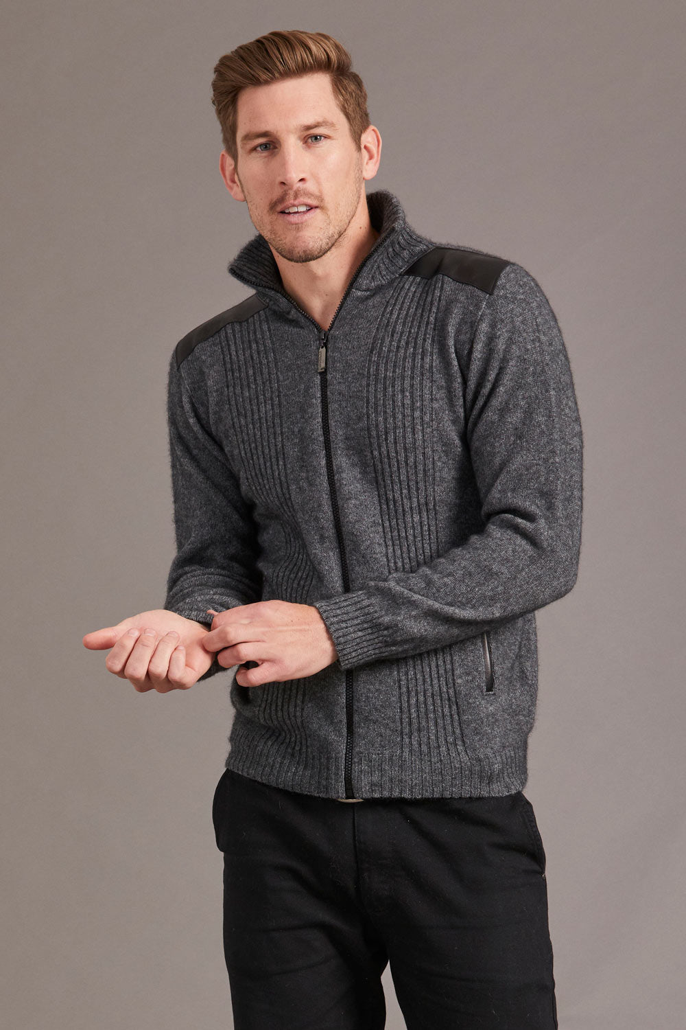 This very sharp looking zip up jacket features genuine lambskin trim on the shoulders and pockets. The turn back collar and front panels have a rib pattern adding more style. Made from natural fibres of Possum Merino and Mulberry silk and in a winter weight it will keep you so warm. The lambskin shoulder and pocket trim are washable. Made by McDonald of NZ.